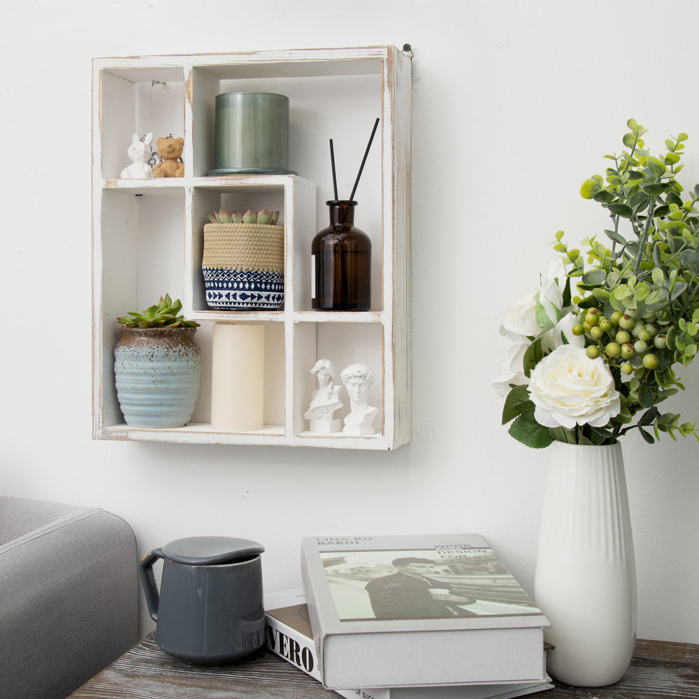 Living room wall featuring a 5 cubby wall mounted decorative shelf with a whitewashed finish with link to wall shelves